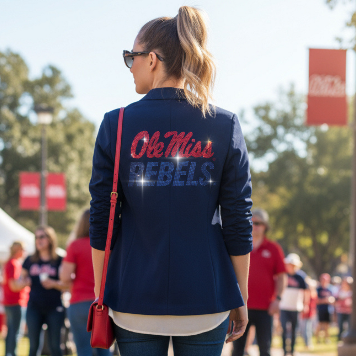 Person wearing an 'Ole Miss Rebels' jacket in a casual outdoor setting.