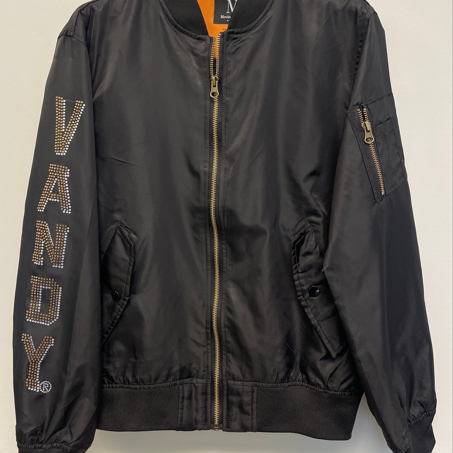 Black bomber jacket with &