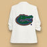 White blazer with a beaded alligator design on the back against a white background