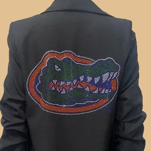 Black blazer with a colorful alligator logo on a mannequin against a white background