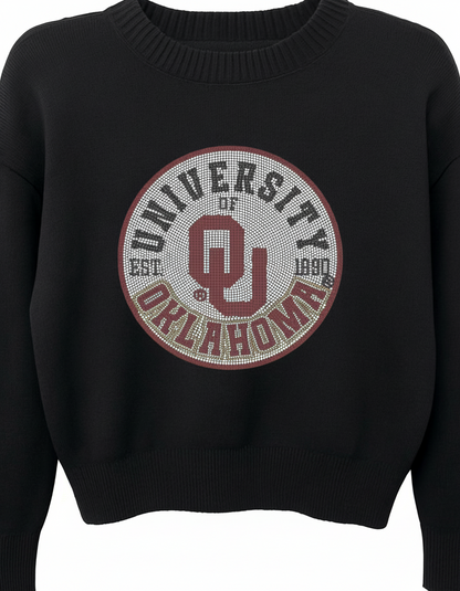 Black sweater with University of Oklahoma logo on a light background