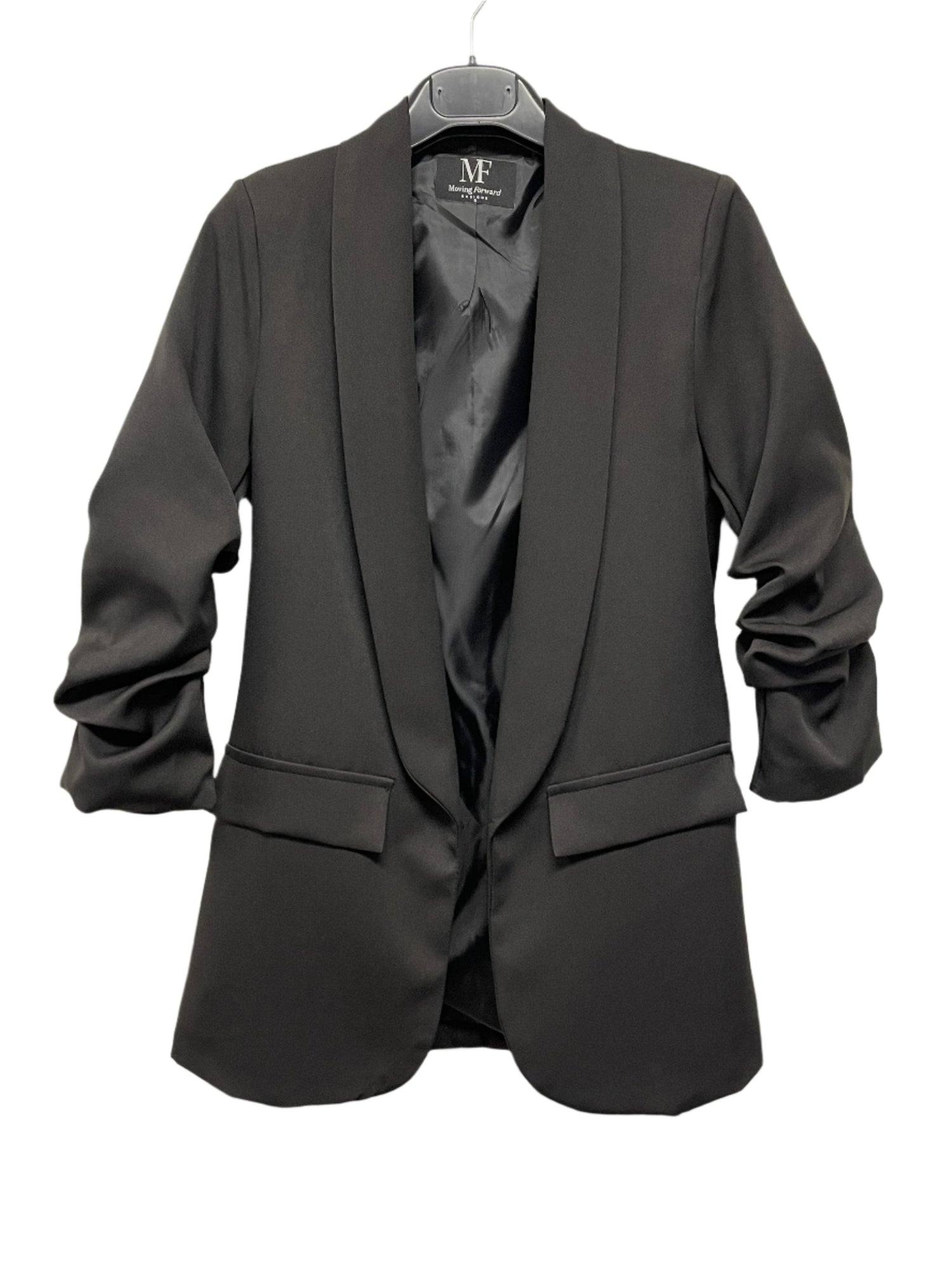 Black blazer on a hanger with a visible brand label against a white background