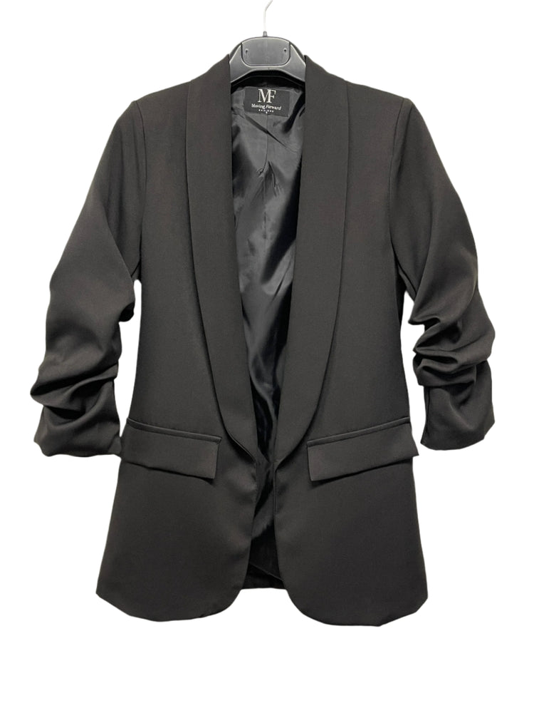 Black blazer on a hanger with a visible brand label against a white background