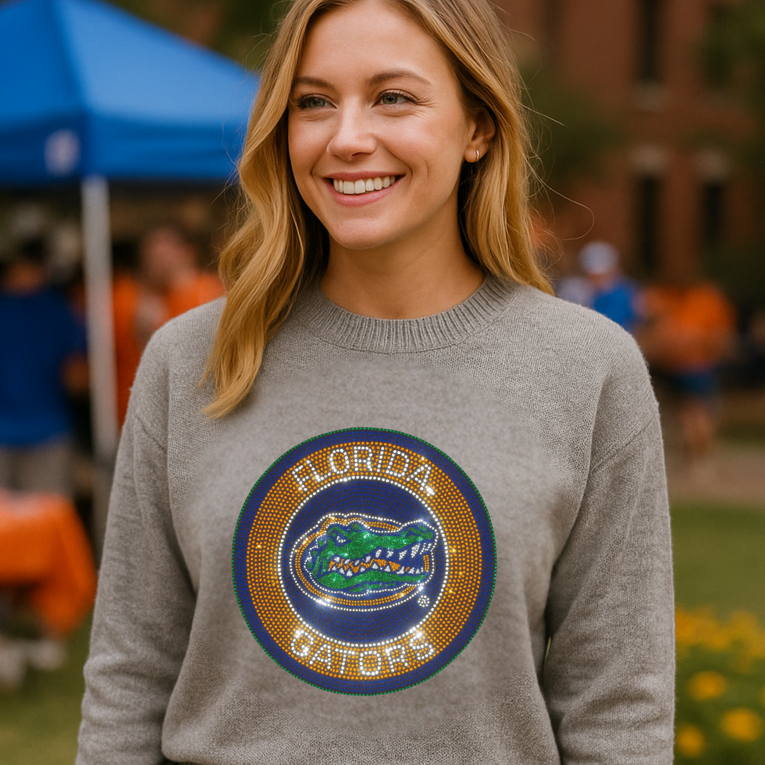 Woman wearing a gray sweater with a Florida Gators logo outdoors.