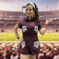Woman wearing a maroon romper with &