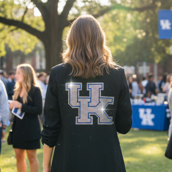 Person wearing a black blazer with &