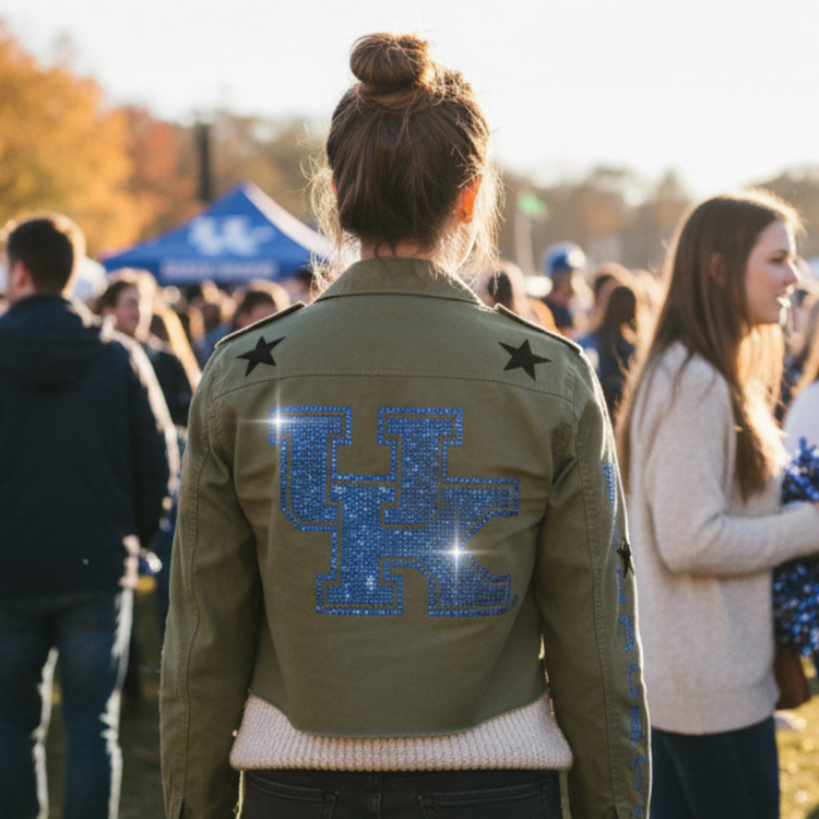 Person wearing a green jacket with &