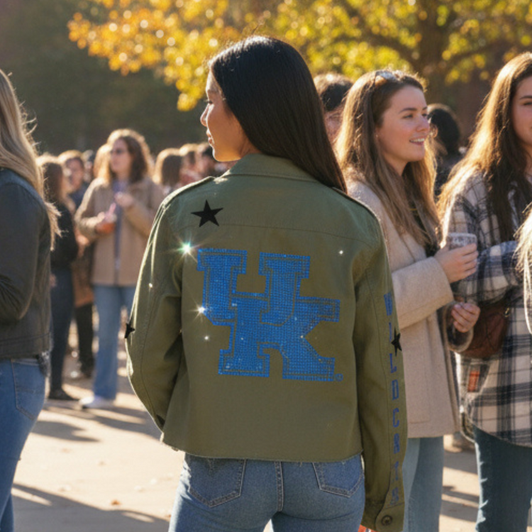 Person wearing a green jacket with a blue &