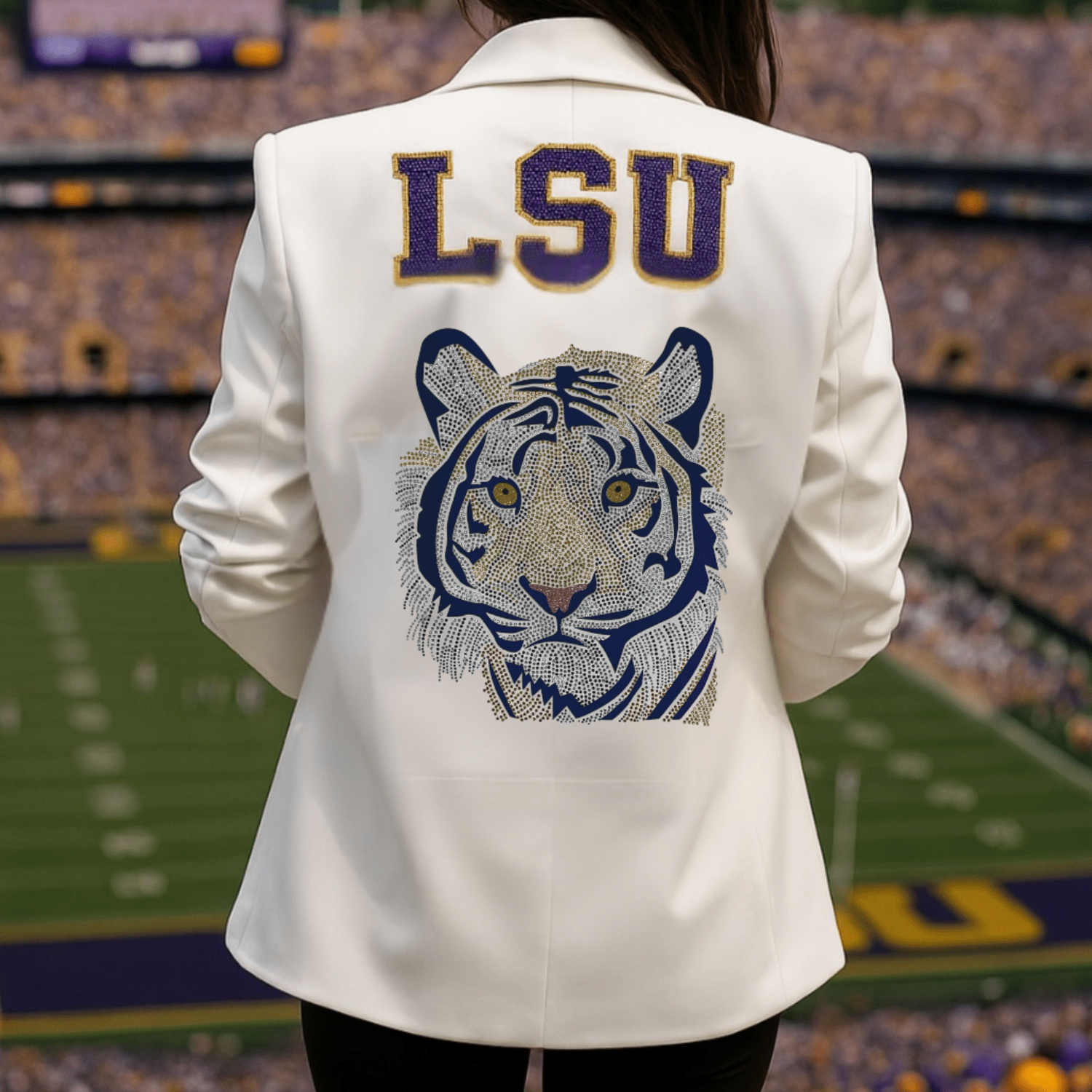 Person wearing a white jacket with LSU logo at a stadium