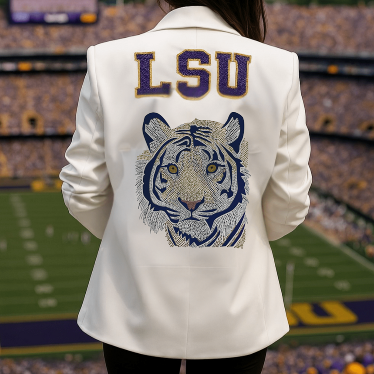 Person wearing a white jacket with LSU logo at a stadium