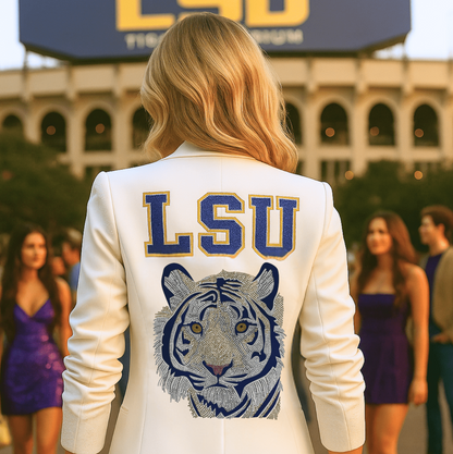 Person wearing a white jacket with LSU logo and tiger emblem in front of LSU stadium.