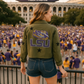 Person wearing an LSU jacket at a stadium event