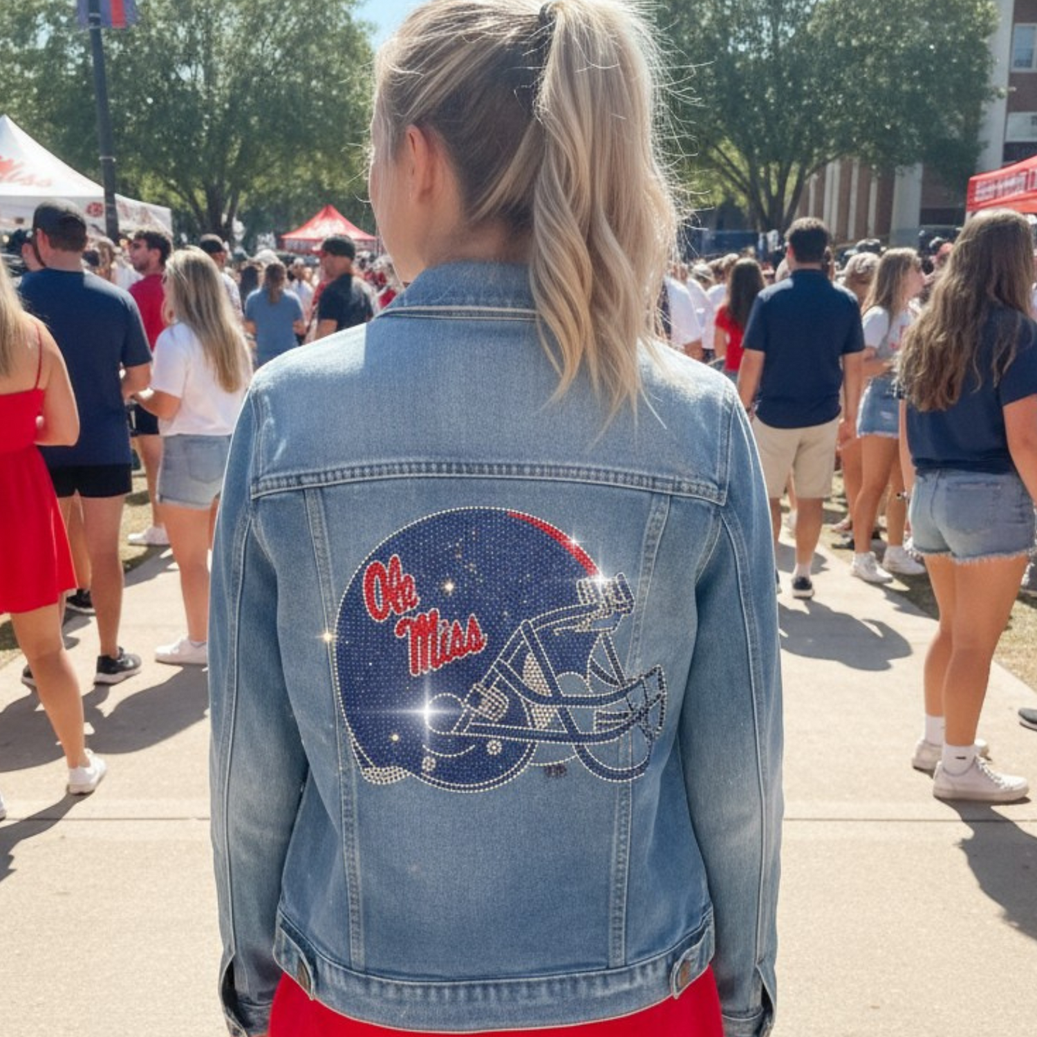 Person wearing a denim jacket with &