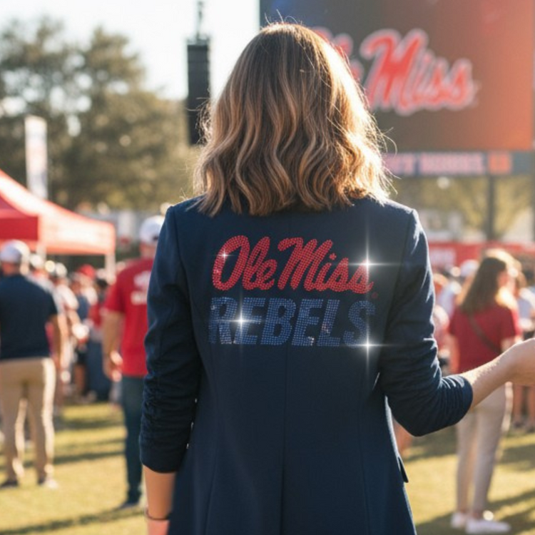 Person wearing a navy blazer with &