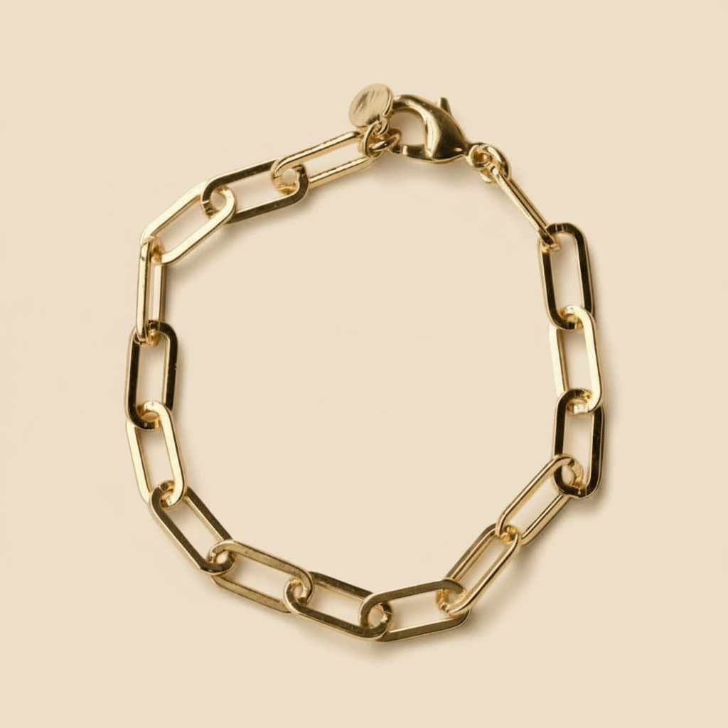 Gold chain bracelet on a white background