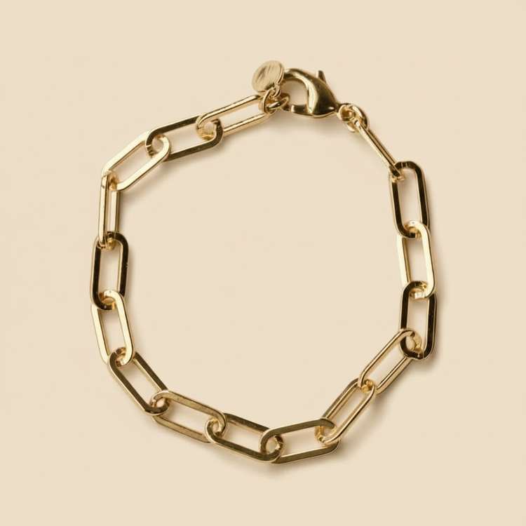 Gold chain bracelet on a white background