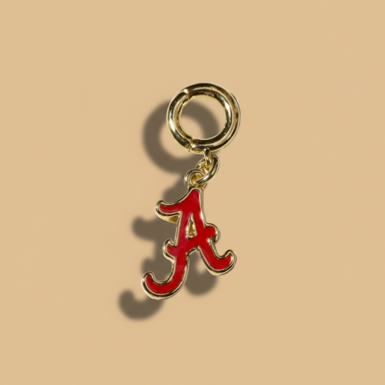 Gold charm with red &