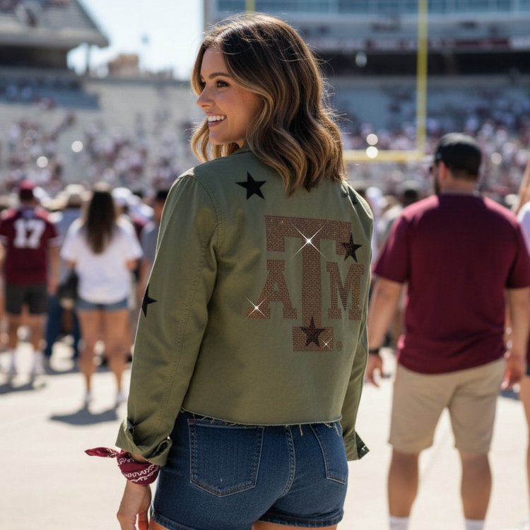 Woman wearing a green jacket with &