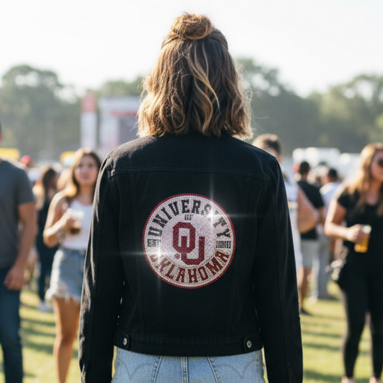 Person wearing a black jacket with &