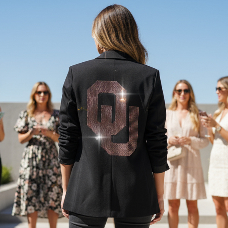 Person wearing a black jacket with &