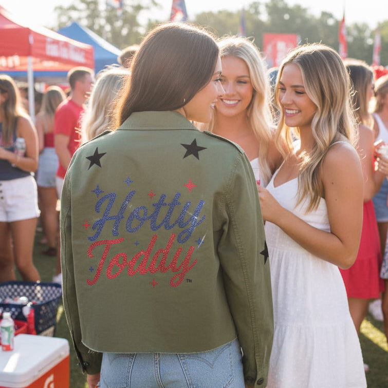 Person wearing a green jacket with &