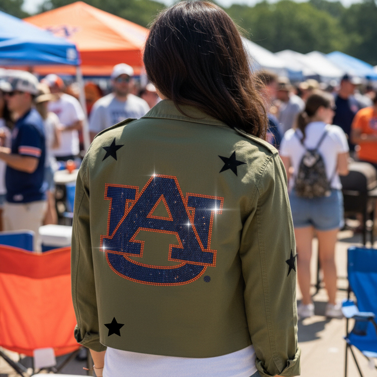 Person wearing an olive green jacket with &