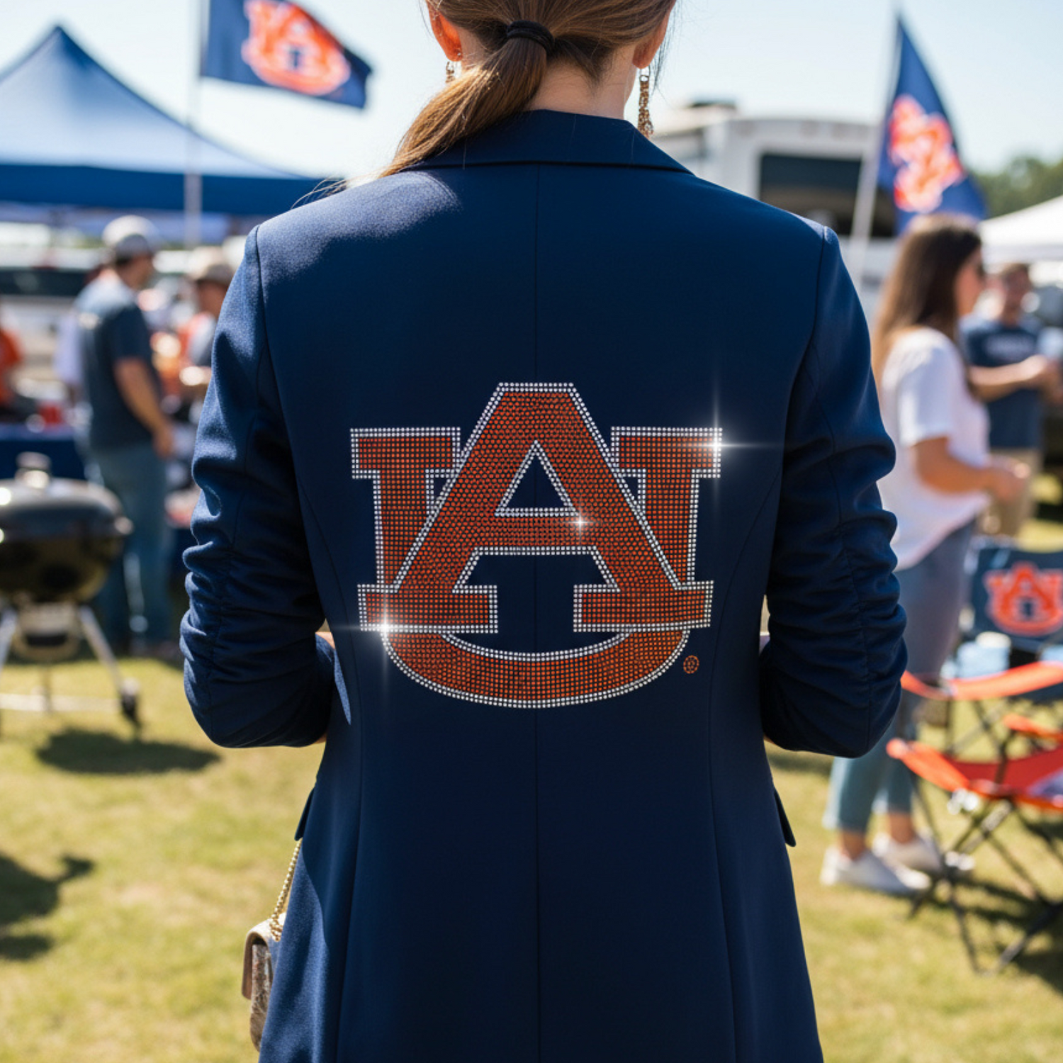 Person wearing a navy blazer with &