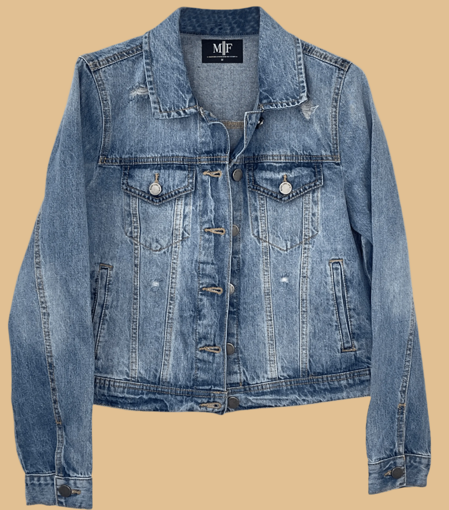 Blue denim jacket with brand label on a white background