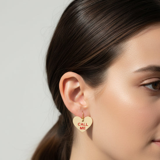 Close-up of a person wearing a heart-shaped &