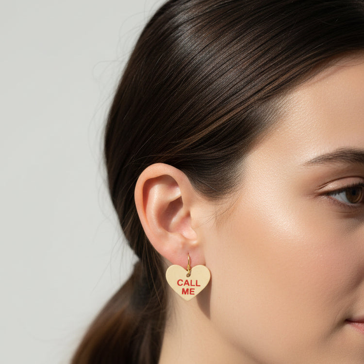 Close-up of a person wearing a heart-shaped &