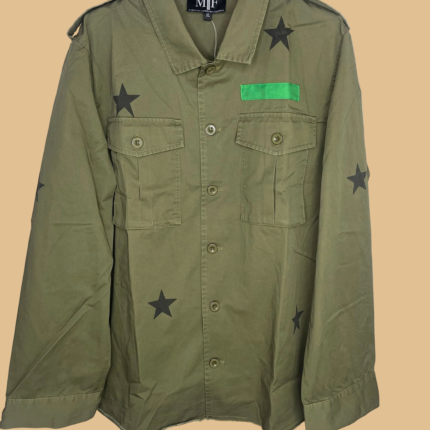 Green jacket with star patterns and a green patch on a white background