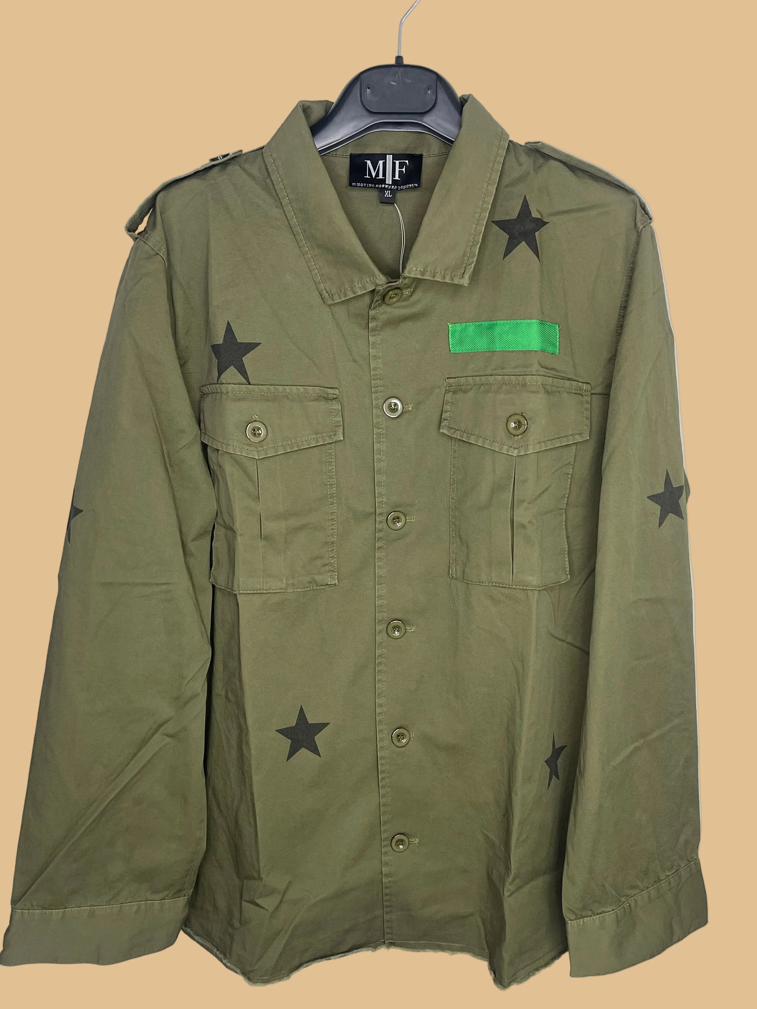 Green jacket with star patterns and a green patch on a white background
