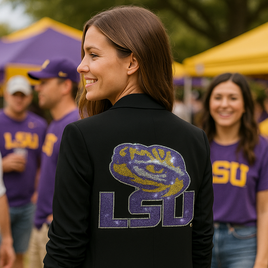 Person wearing a black jacket with LSU logo at an outdoor event