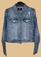 Blue denim jacket on a hanger with a visible brand label against a white background
