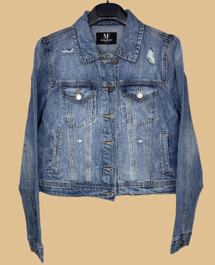 Blue denim jacket on a hanger with a visible brand label against a white background