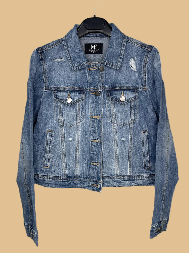 Blue denim jacket on a hanger with a visible brand label against a white background