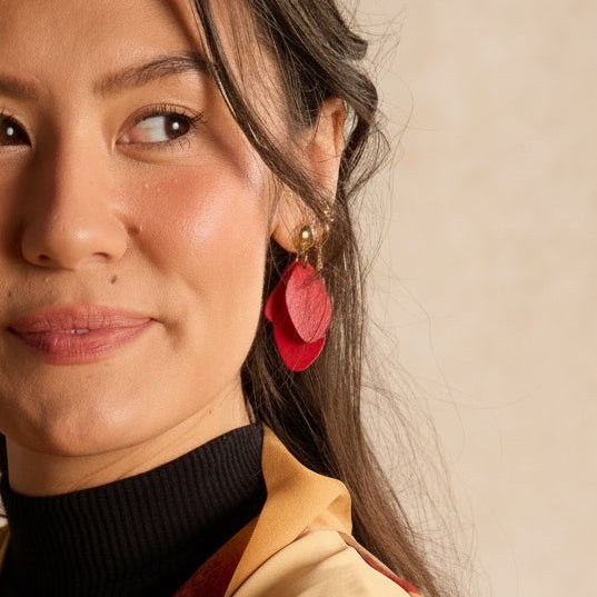 Woman holding a traditional mooncake against a beige background