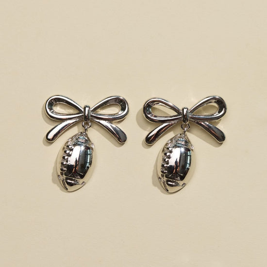 Silver Football & Bow Drop Studs
