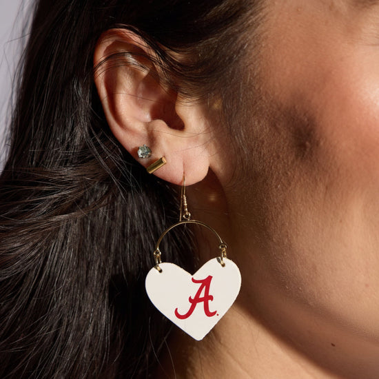 Heart-shaped earring with a red letter &