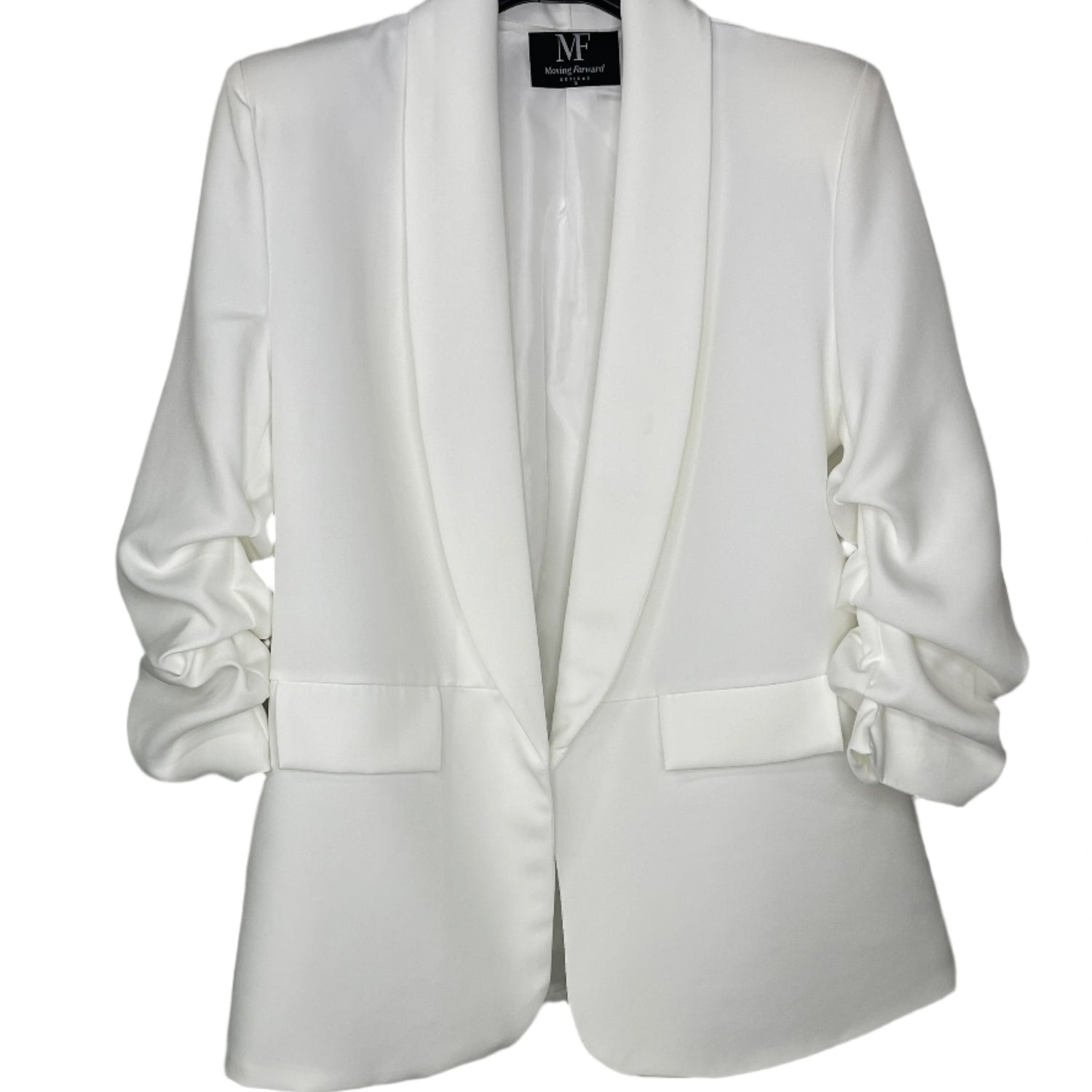 White blazer on a hanger with a visible brand label against a white background