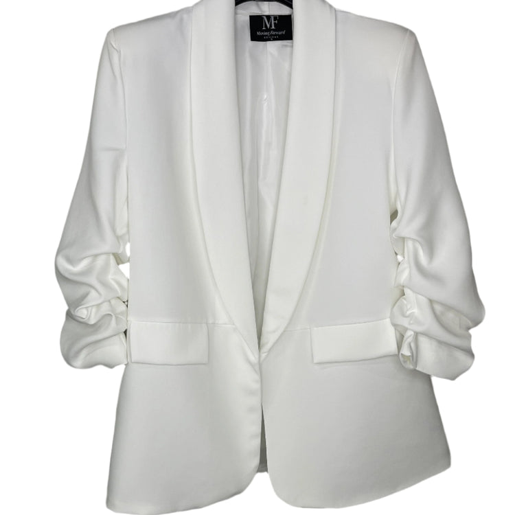 White blazer on a hanger with a visible brand label against a white background